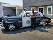 1950 Dodge police car with CAPS President & Support Services Manager Jen Torres