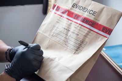 Sealed evidence bag being written on