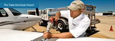 Man filling airplane gas tank